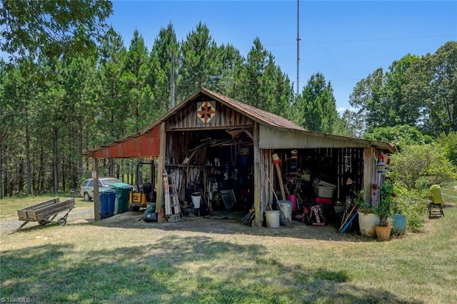 view of outbuilding featuring a yard