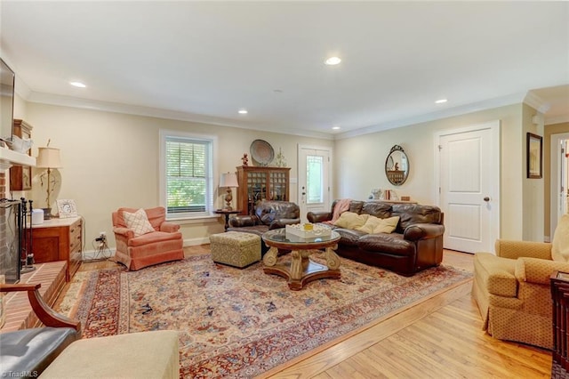 living room featuring crown molding and hardwood / wood-style flooring