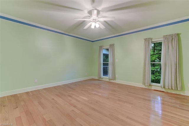 unfurnished room with light wood-type flooring, ceiling fan, and ornamental molding