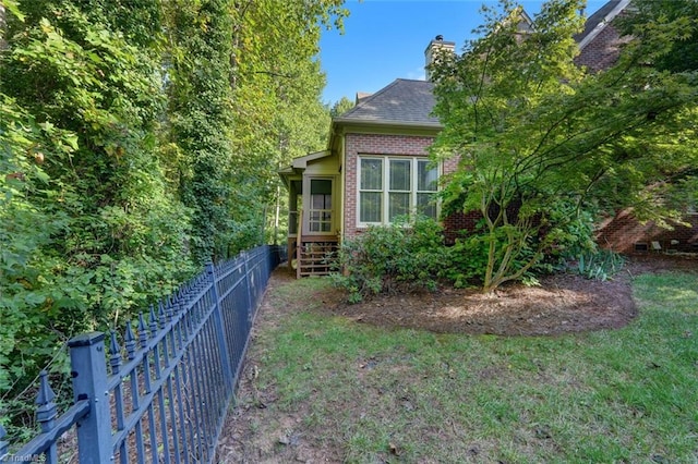 view of home's exterior featuring a lawn