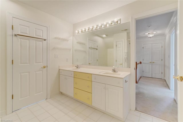 bathroom featuring vanity and ornamental molding