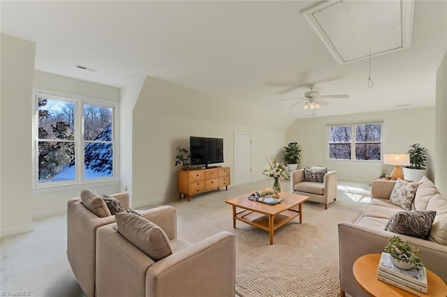 carpeted living room with lofted ceiling and ceiling fan