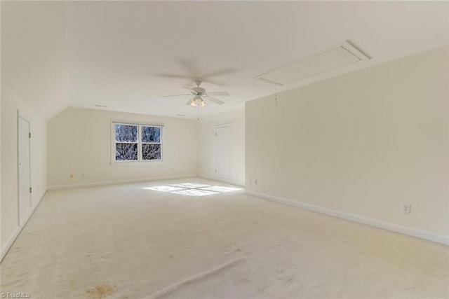 carpeted empty room with lofted ceiling and ceiling fan