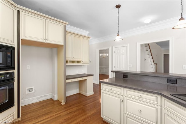 kitchen with cream cabinetry, black appliances, light wood-style flooring, dark countertops, and crown molding