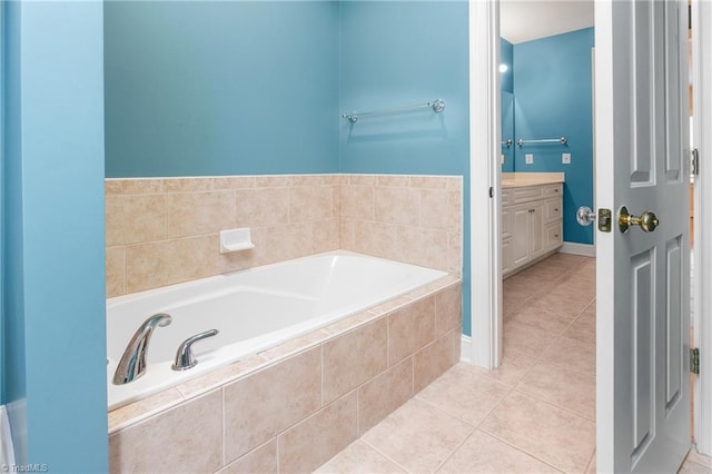 full bathroom with a bath, vanity, and tile patterned flooring