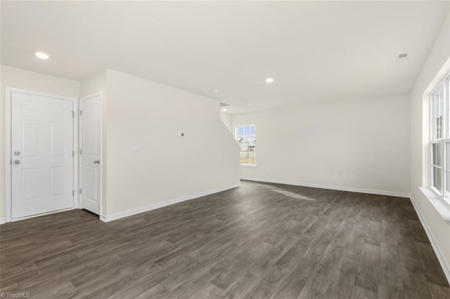 unfurnished room featuring dark hardwood / wood-style floors