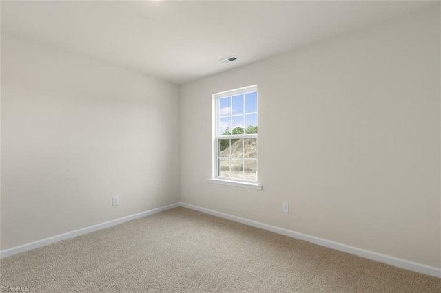 empty room with carpet flooring