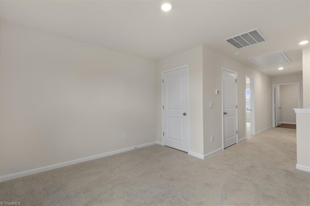 empty room with light colored carpet