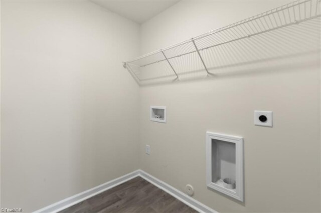 laundry room featuring dark wood-type flooring, hookup for a washing machine, gas dryer hookup, and electric dryer hookup