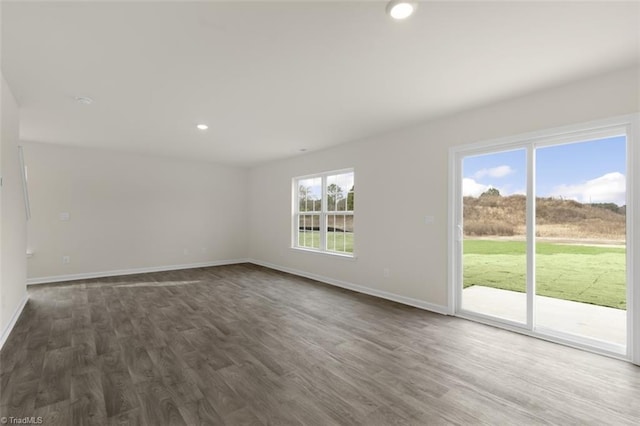 spare room with hardwood / wood-style flooring