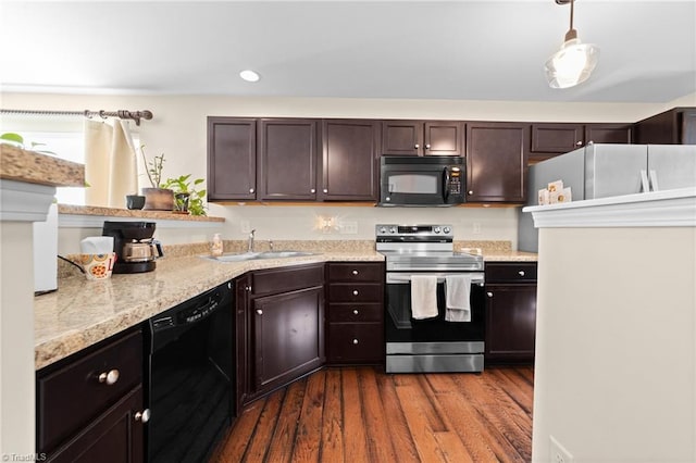 kitchen with a sink, black appliances, dark brown cabinetry, and dark wood-style flooring