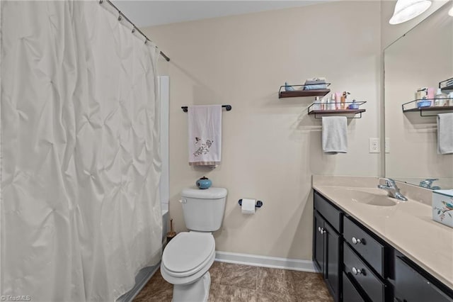 bathroom featuring baseboards, toilet, a shower with curtain, tile patterned flooring, and vanity