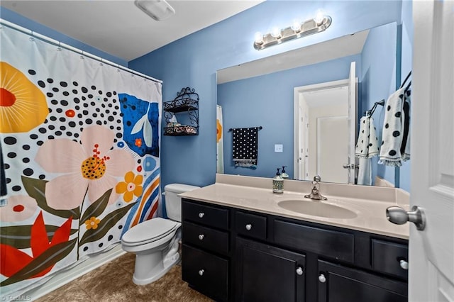 full bathroom with tile patterned flooring, a shower with curtain, vanity, and toilet