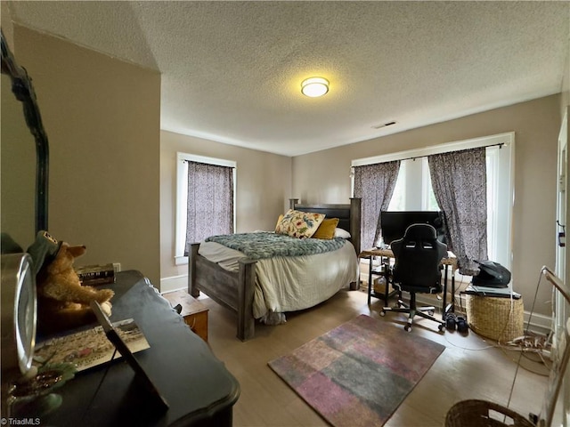 bedroom featuring a textured ceiling