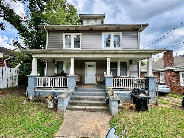 view of front of home featuring a porch and a front yard