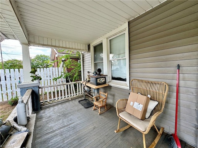 wooden terrace featuring covered porch