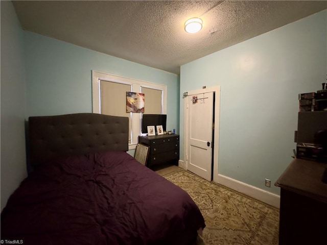 bedroom with a textured ceiling