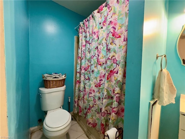 bathroom featuring tile patterned flooring, vanity, a shower with curtain, and toilet