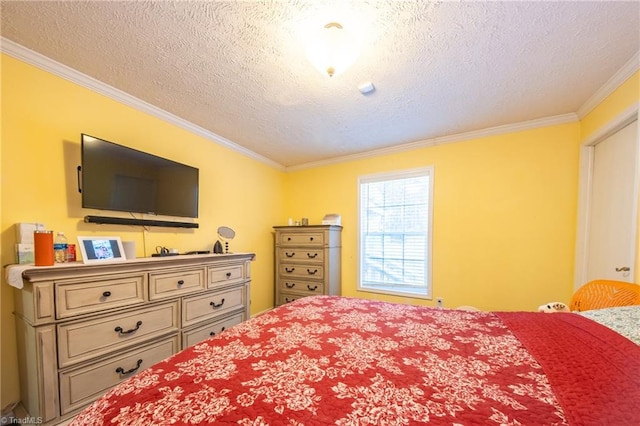 bedroom featuring ornamental molding and a textured ceiling