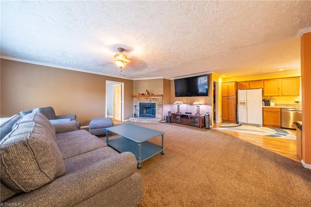 carpeted living room featuring crown molding, a fireplace, and a textured ceiling