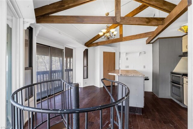 dining area with dark hardwood / wood-style floors, vaulted ceiling with beams, and a chandelier