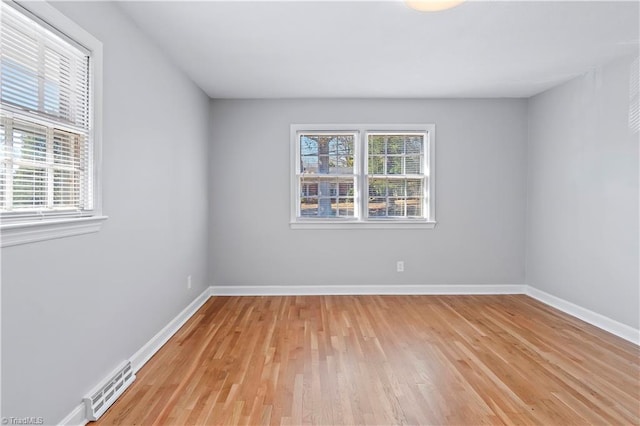 empty room with light hardwood / wood-style floors