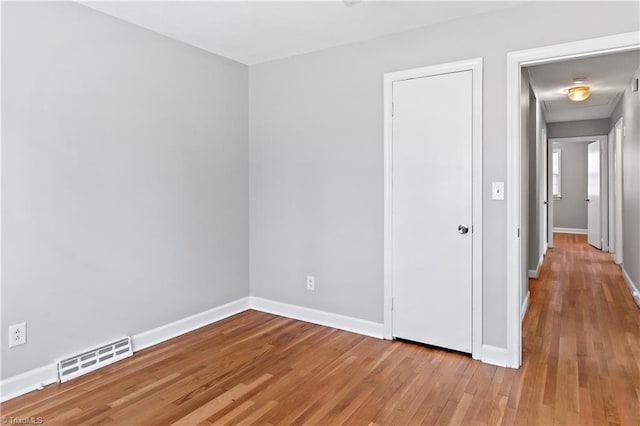 spare room with light hardwood / wood-style floors