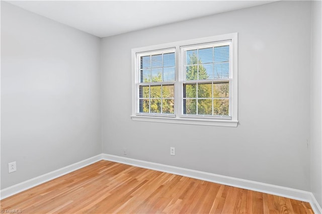 empty room featuring hardwood / wood-style flooring