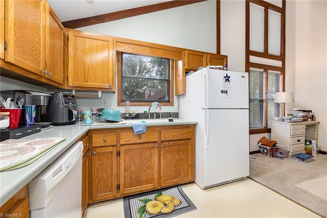 kitchen featuring vaulted ceiling with beams, sink, and white appliances