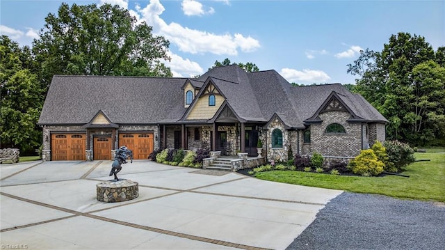2643 NC Highway 801, Mocksville, NC 27028 - view of front of property featuring stone siding, driveway, a garage, and a front lawn