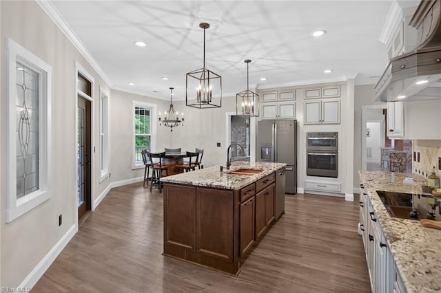 2643 NC Highway 801, Mocksville, NC 27028 - kitchen with appliances with stainless steel finishes, ornamental molding, dark wood-style floors, recessed lighting, and wall chimney exhaust hood
