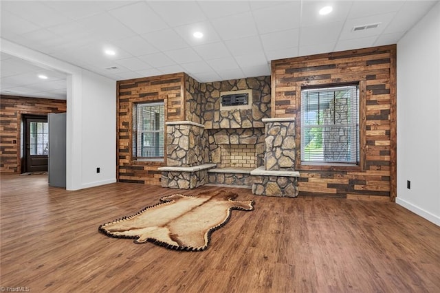 2643 NC Highway 801, Mocksville, NC 27028 - unfurnished living room with wood finished floors, a wall mounted air conditioner, recessed lighting, and a paneled ceiling