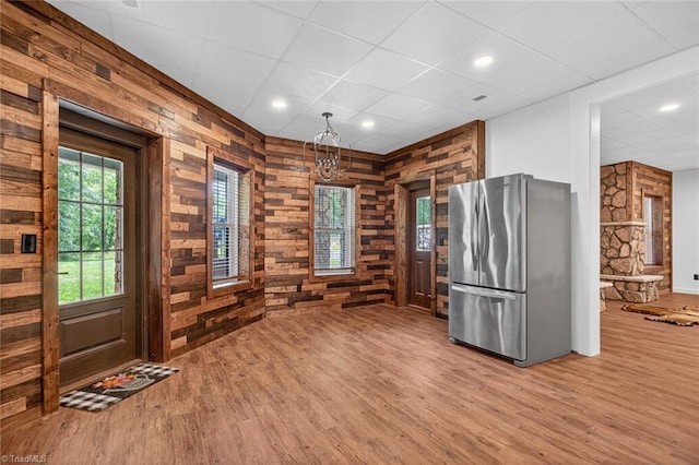 2643 NC Highway 801, Mocksville, NC 27028 - kitchen featuring freestanding refrigerator, light wood-style floors, wooden walls, a paneled ceiling, and recessed lighting
