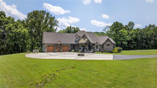 2643 NC Highway 801, Mocksville, NC 27028 - view of front of home featuring driveway, a front yard, a garage, and stone siding
