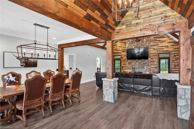 2643 NC Highway 801, Mocksville, NC 27028 - dining room with a chandelier, wood finished floors, a stone fireplace, and a towering ceiling