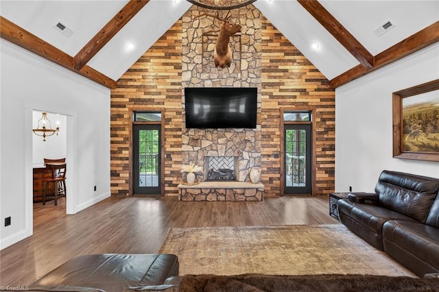 2643 NC Highway 801, Mocksville, NC 27028 - living area featuring high vaulted ceiling, beamed ceiling, a fireplace, and wood finished floors