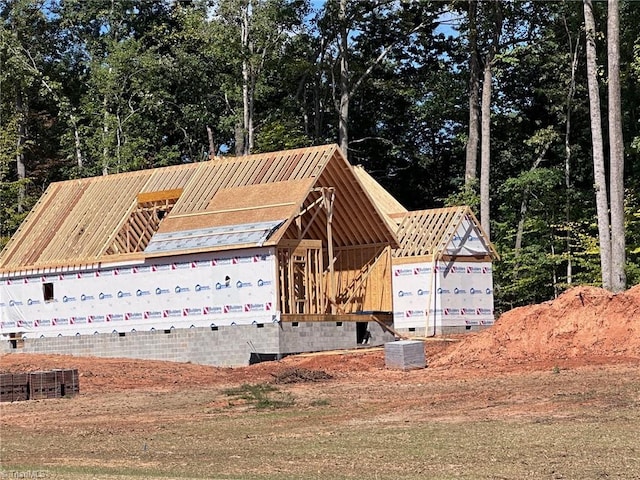 view of front of house with an outbuilding and crawl space