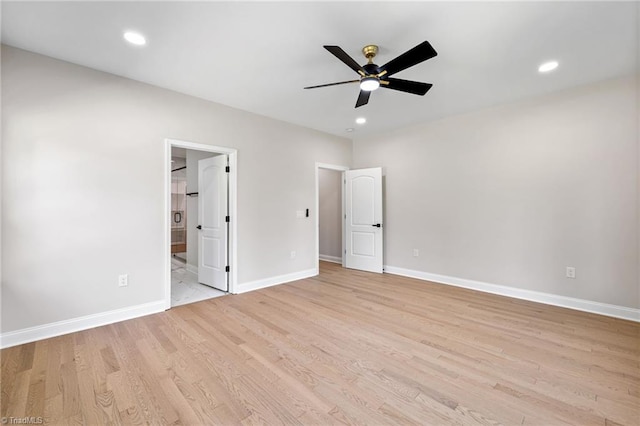 unfurnished bedroom with connected bathroom, baseboards, light wood finished floors, and recessed lighting