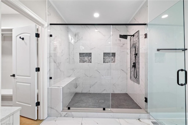 full bath featuring recessed lighting, marble finish floor, and a marble finish shower