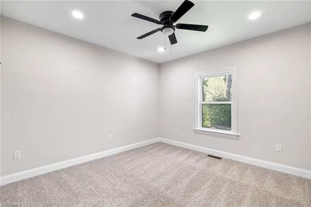 carpeted spare room featuring baseboards, visible vents, recessed lighting, and ceiling fan