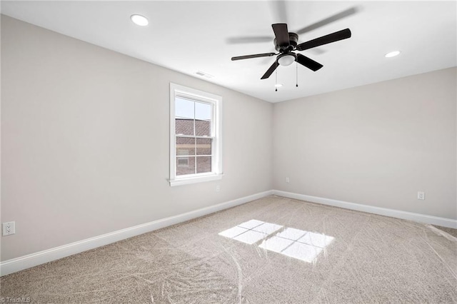 spare room featuring ceiling fan, light colored carpet, baseboards, visible vents, and recessed lighting