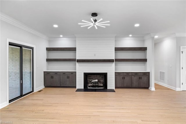 unfurnished living room with recessed lighting, visible vents, and baseboards