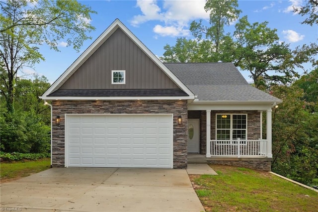 view of front of property featuring covered porch and a garage