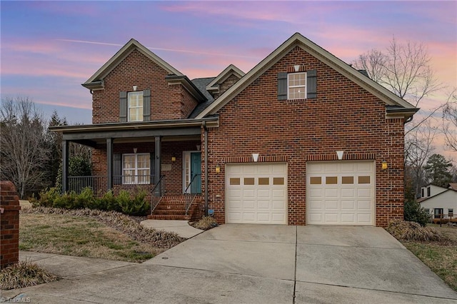 front of property featuring a garage and covered porch