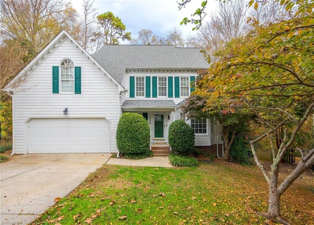 view of front facade featuring a garage and a front yard