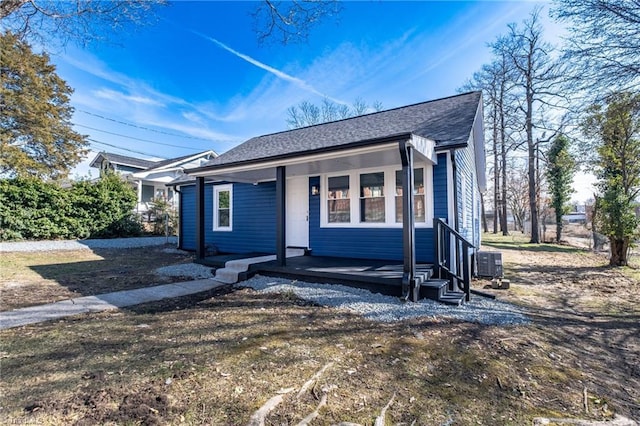 view of front of house with cooling unit and covered porch