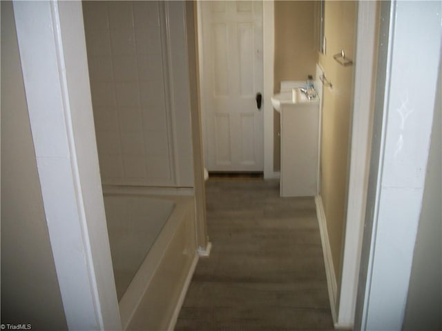 corridor featuring dark hardwood / wood-style flooring