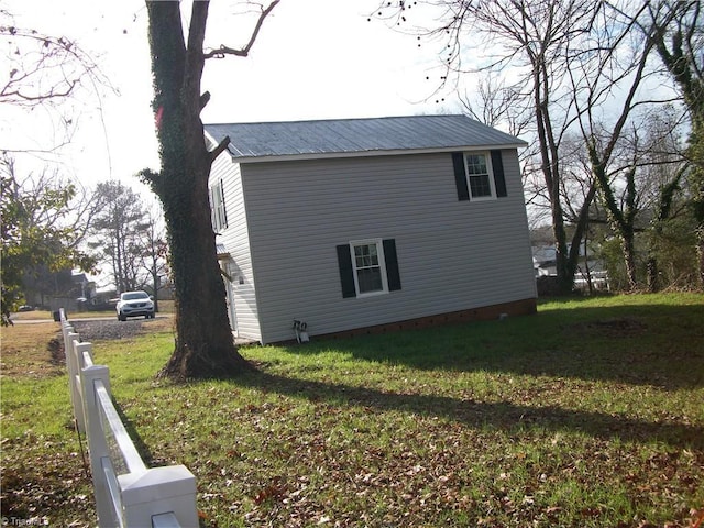 view of property exterior with a yard