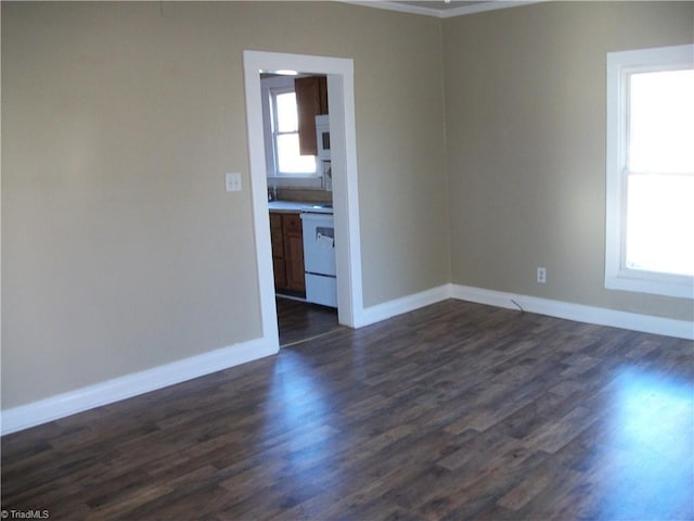 unfurnished room featuring dark hardwood / wood-style flooring