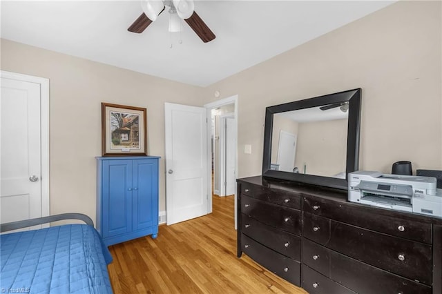 bedroom featuring light wood finished floors and ceiling fan